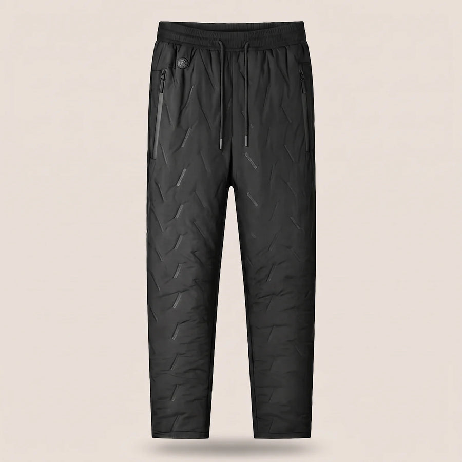 Heated pants in black with elastic waist, drawcord and zip pockets