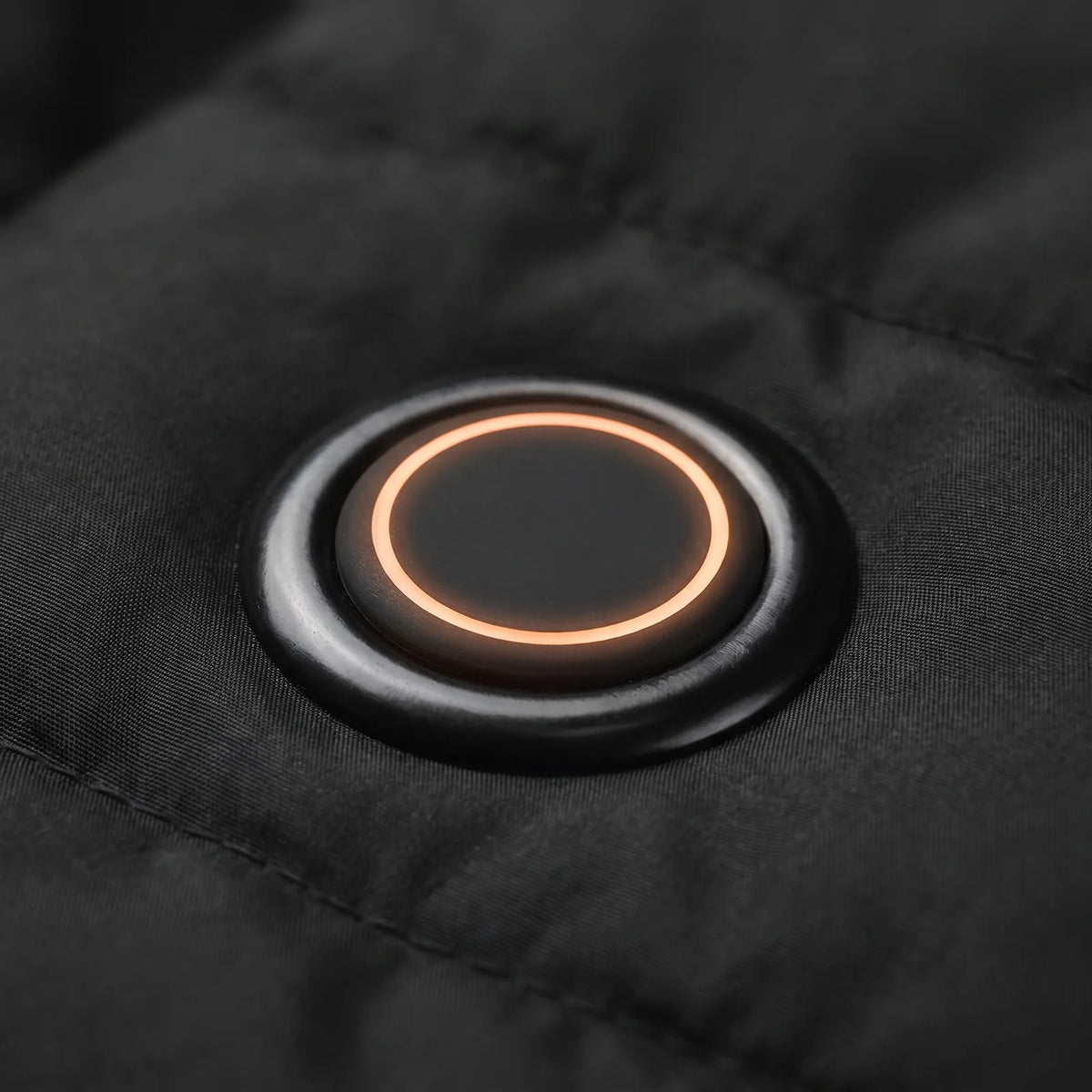 Round chest button with a glowing ring for three heat settings