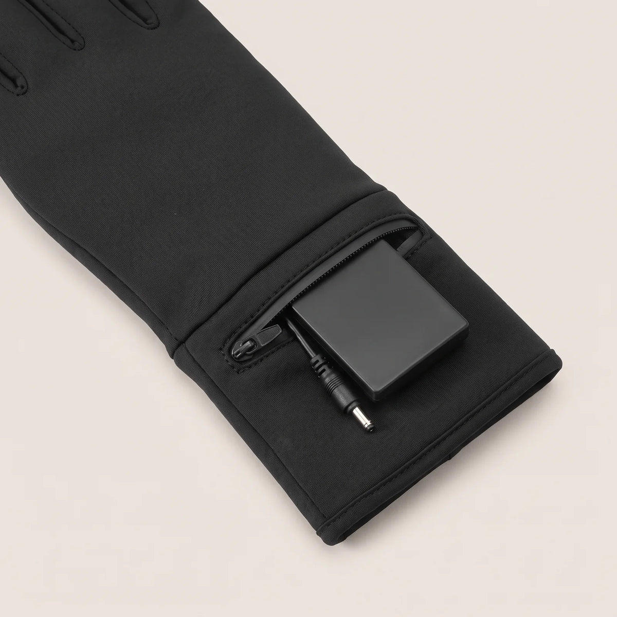 Battery in the zippered cuff pocket of the heated glove