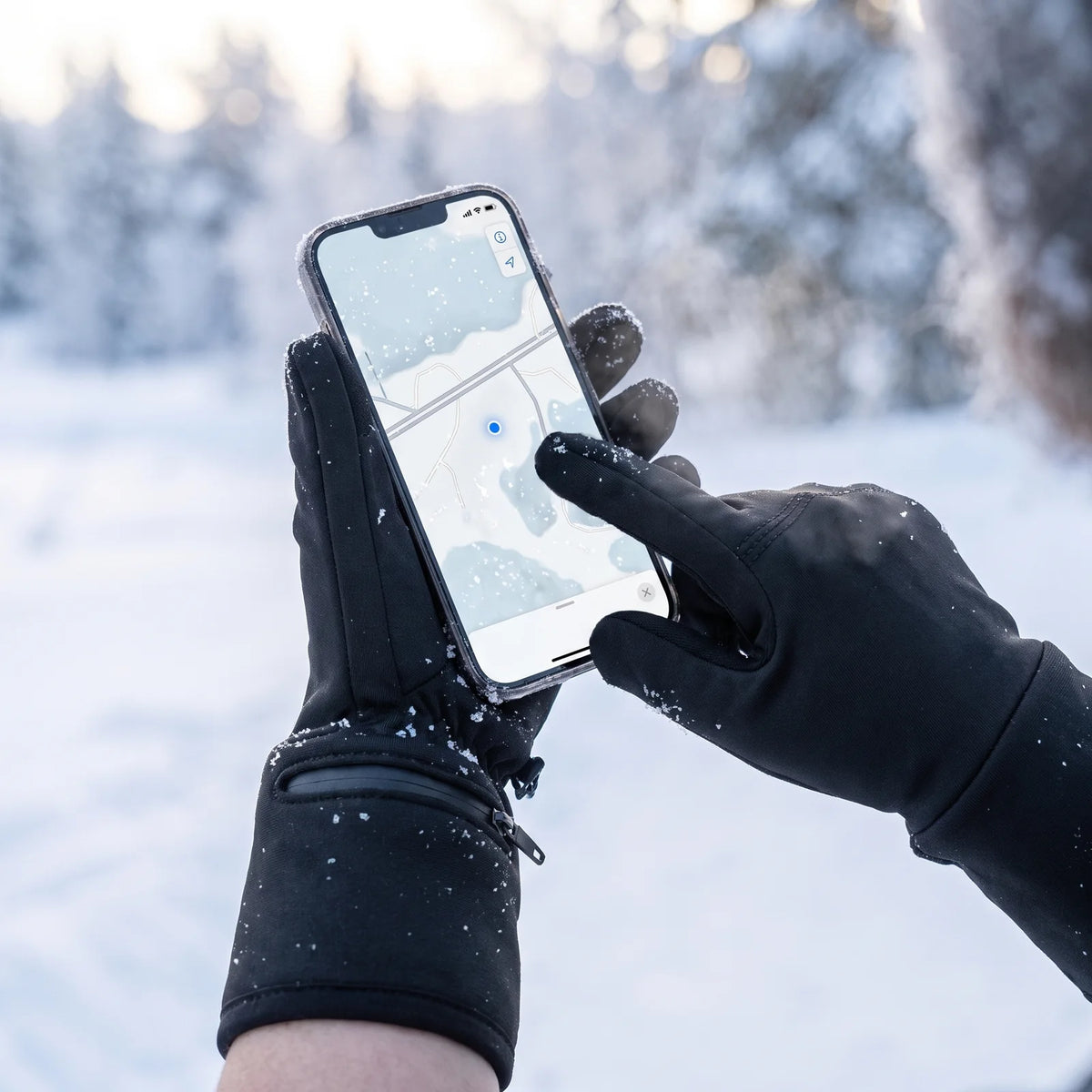 Using a phone in the snow while wearing the heated gloves